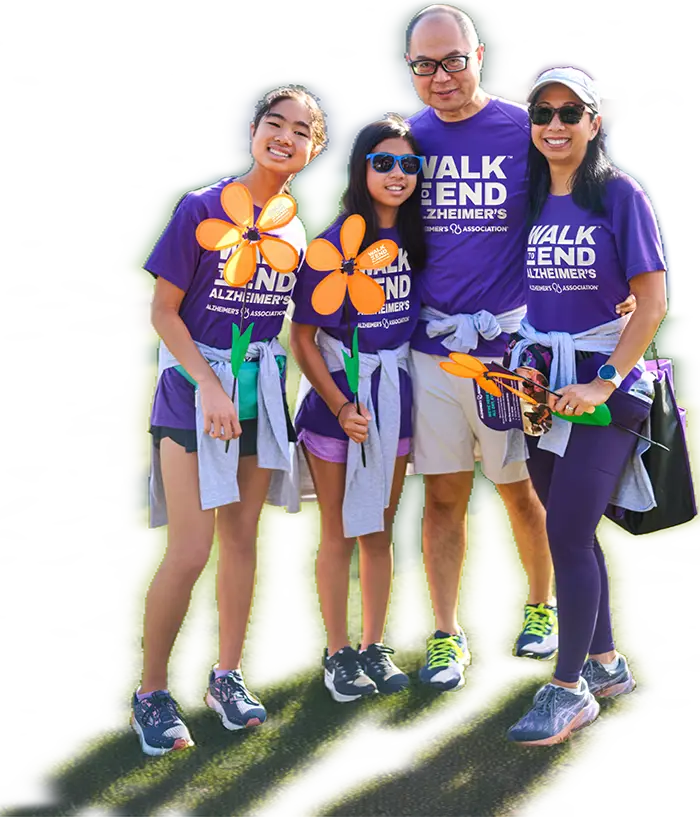 Partecipanti alla Walk to End Alzheimer’s con fiori colorati